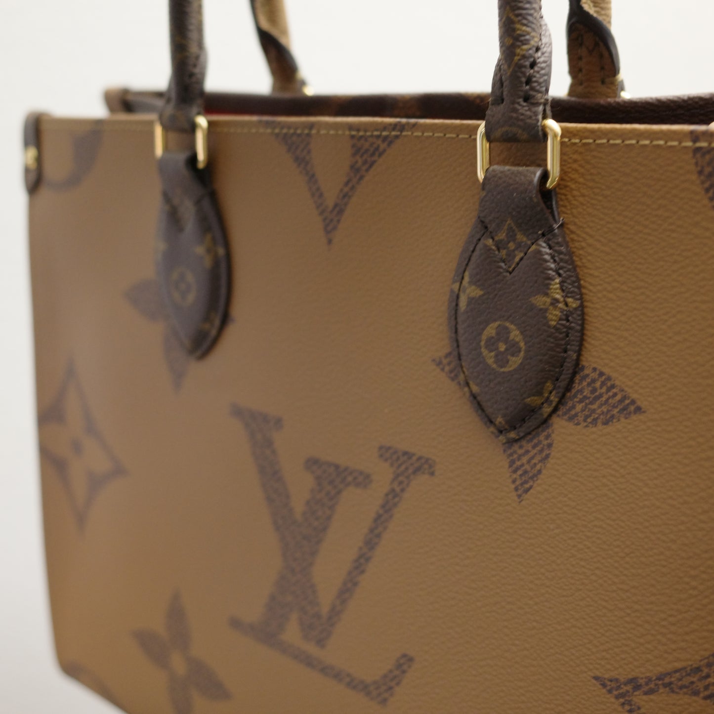 Louis Vuitton OntheGo MM Reverse Monogram with Leather Handles